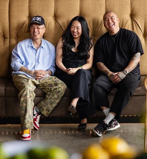 Portrait of the After Ours team on a banquette.